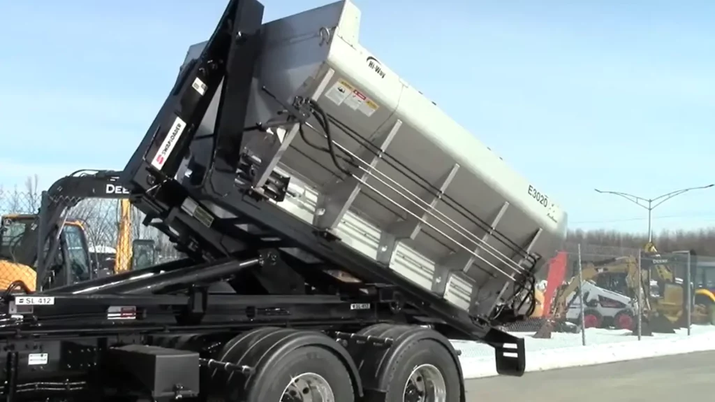 A truck is utilizing the swaploader hook lift system