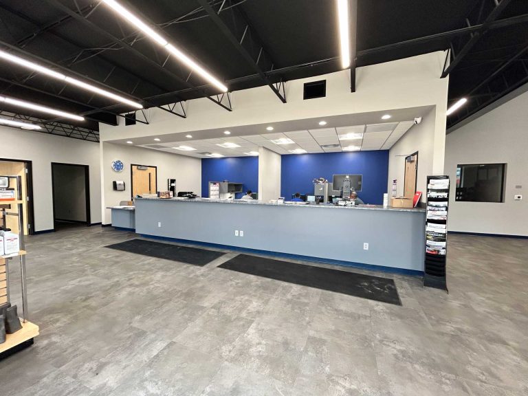 Interior of Wilkes Barre Location with a light blue counter and dark blue back wall.